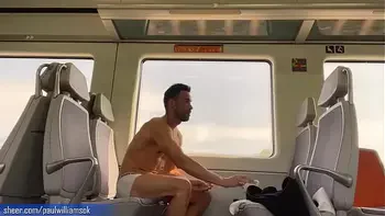 Sexy tanned man travelling naked by train. Very risky public nudity