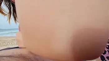 Cute Babe Sucking Cock on a public Beach and receives a mouth Creampie