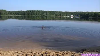 Naked girl goes skinny dipping in public beach