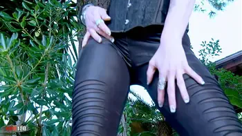 Pretty redhead Lyza Vondee getting naked in the wild