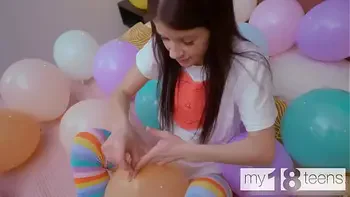 MY18TEENS - Skinny girl with small tits blows up balloons and fucks herself with a dildo