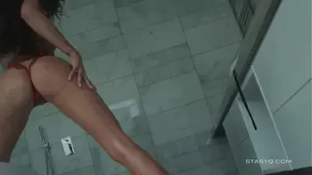 Busty russian babe Megan teasing from the bathtub