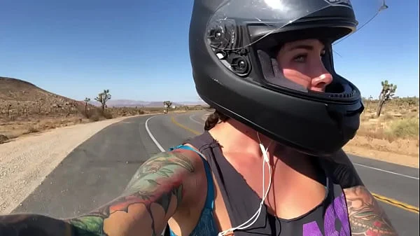 felicity feline riding on aprilia tuono motorcycle