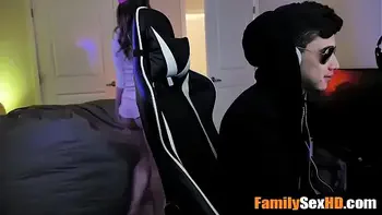 Stepsister fucks stepbrother while he is playing video games