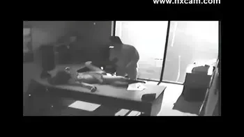 Security camera Films Sex At Office On Desk