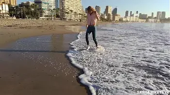 Wet shoot on a public beach with Crazy Model. Risky outdoor masturbation. Foot fetish. Pee in jeans.