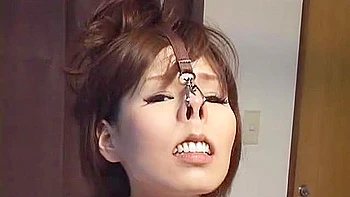 She is naked, her nostrils are lifted and her nipples are pinched.