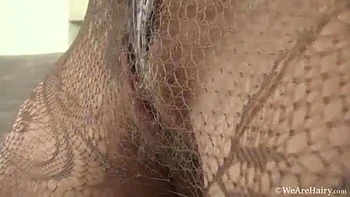 Nadin strips after getting bored watching tv - WeAreHairy