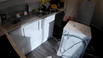 Horny wife seduces a plumber in the kitchen while her husband at work.
