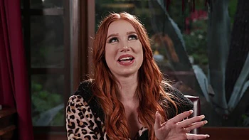 The red head Madison Morgan shows her assets in a captivating video