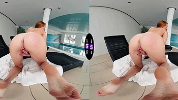 A cute and sweet red-haired girl named Holly Molly plays with her pussy.