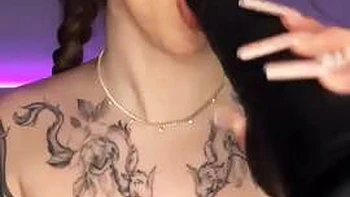 The long-haired nymph in a cat costume provides a deep throat with a yam-sized