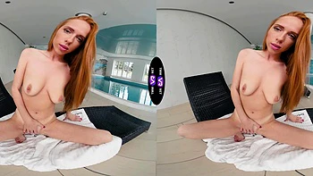 Redhead beauty Holly Molly wanking her pussy in the kitchen