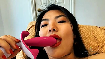 Watch Nari Park play with her hairy Asian pussy while adding a toy to the mix: Porn