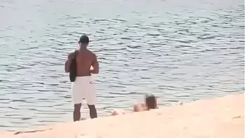 Black dude looks for horny babes at the nude beach and bangs one of 'em