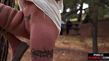 Cute bonded babe dominated outside