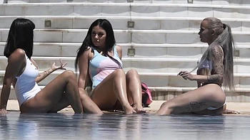 A group of girls have fun at the pool with toys and more