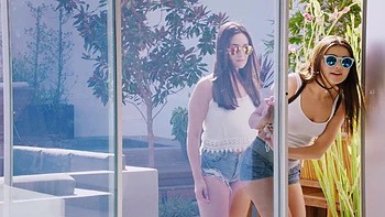 Two cute girls share a big cock in an intense threesome