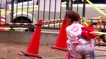 A man appears, touches her body, gives her a blowjob, and inserts a vibrator, causing her to wet herself.