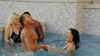 Two girls share a big black cock in an intense interracial threesome