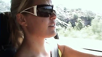 Good outdoor posing session on the beach with a busty Sophie Moone