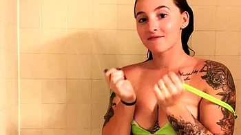 Busty babe playing with her big boobs